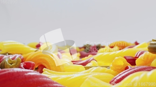 Image of Whole grain colorful pasta in camera motion