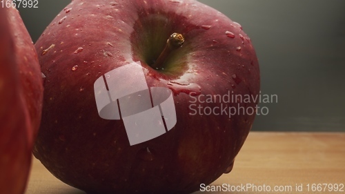 Image of Macro footage in motion of some apples on the table