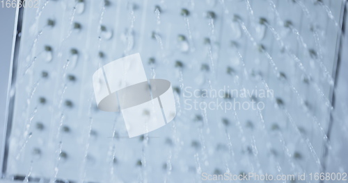 Image of Water flowing from shower head 120 fps slow motion closeup footage