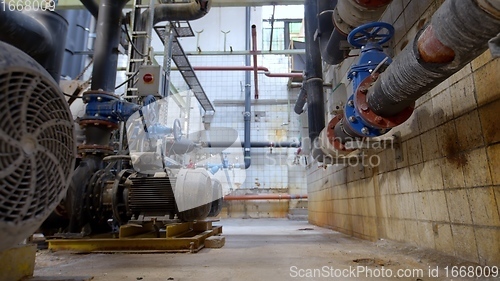 Image of Boiler room full of pipes sliding movement motion