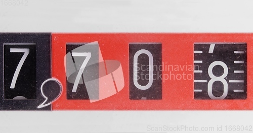 Image of Numbers spinning in old counter