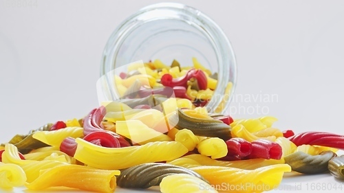 Image of Whole grain colorful pasta in camera motion