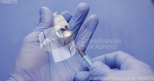 Image of Vaccine in human hands closeup footage