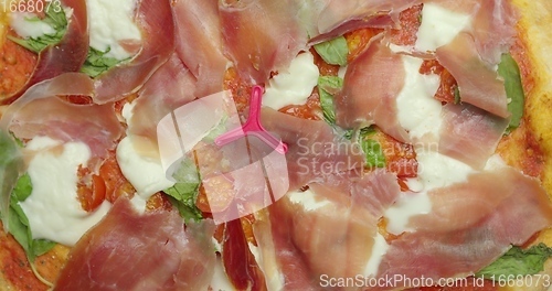Image of Delicious pizza surface with chease and meat rotating