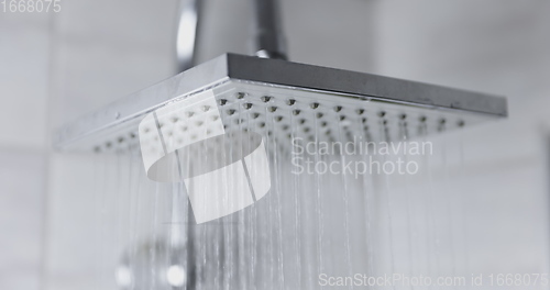 Image of Water flowing from shower head 120 fps slow motion closeup footage