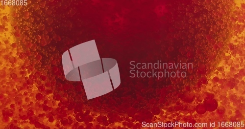 Image of Stream of red blood cells in glowing palasma closeup footage