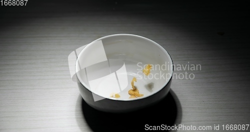 Image of Pouring cereal into bowl closeup