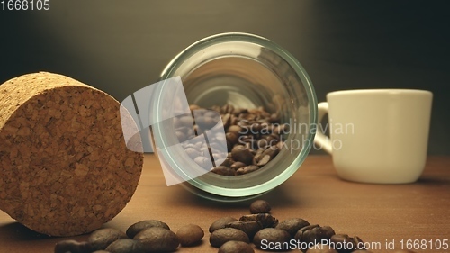 Image of Roasted coffee beans on table in camera motion