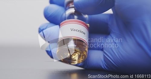 Image of Vaccine in human hands closeup footage