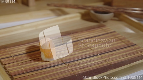 Image of Filling plate with japanese sushi closeup