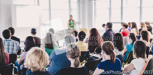 Image of Speaker giving presentation on business conference.