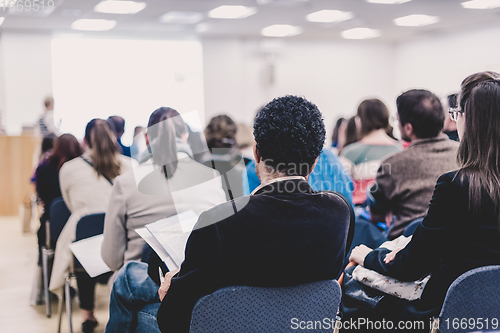 Image of Woman giving presentation on business conference.