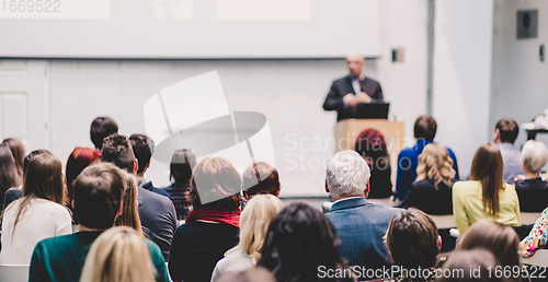 Image of Public speaker giving talk at Business Event.