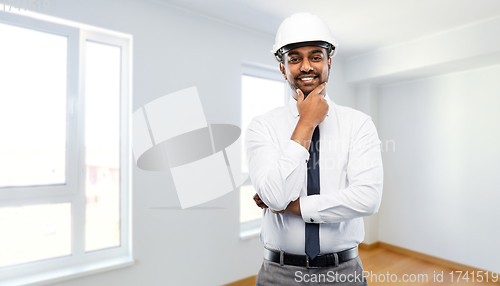 Image of indian male architect in helmet at new apartment
