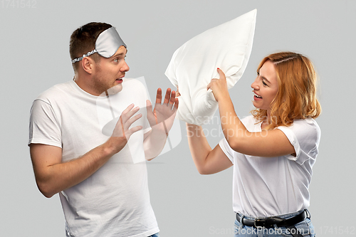 Image of couple with eye sleeping mask and pillow