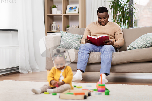 Image of happy father with tablet pc and baby at home