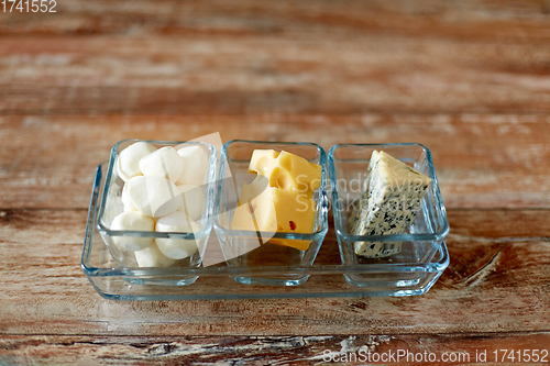 Image of different kinds of cheese in glass cups