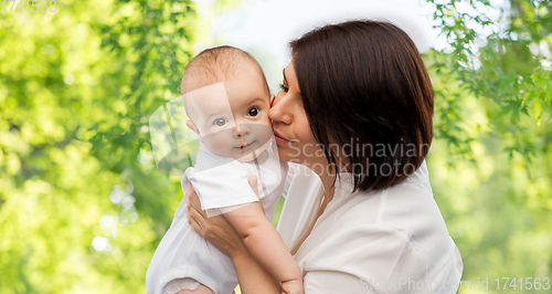 Image of happy mother kissing little baby daughter