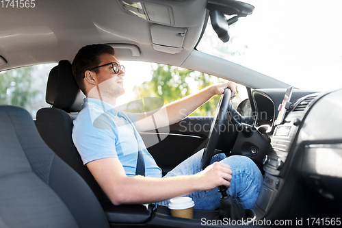 Image of man or driver in glasses driving car in summer