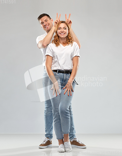 Image of happy couple in white t-shirts