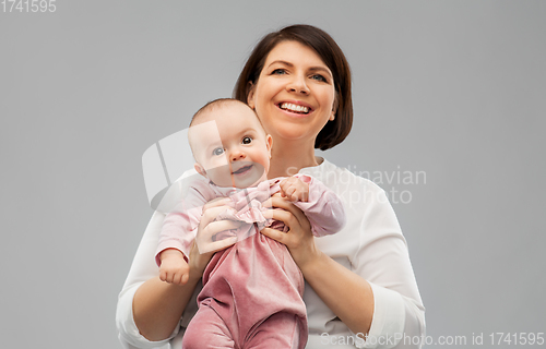 Image of happy middle-aged mother with little baby daughter