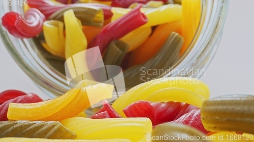 Image of Whole grain colorful pasta in camera motion