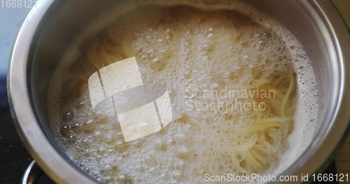 Image of Pasta boiling in steel pot