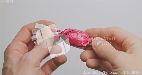 Image of Man opening christmas choclate closeup footage