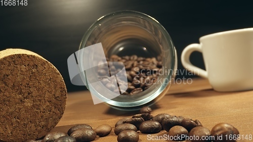 Image of Roasted coffee beans on table in camera motion