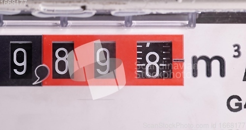 Image of Gas counter closeup footage with numbers spinning