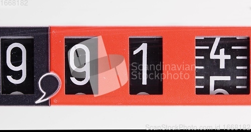 Image of Numbers spinning in old counter