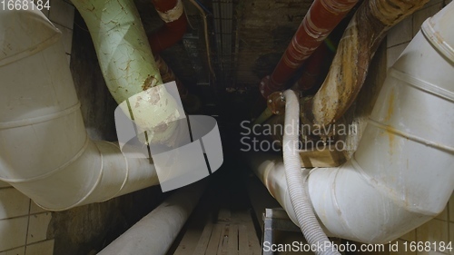 Image of Dark underground tunnel made out of pipes