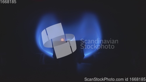 Image of Gas burner flame inside household heat system
