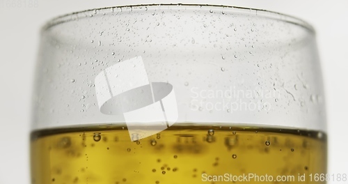 Image of Glass of beer on the table slow motion footage