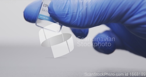 Image of Vaccine in human hands closeup footage