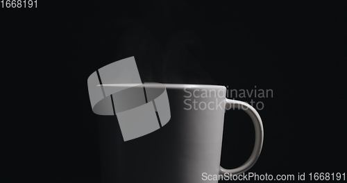 Image of Vapor rising from hot mug closeup footage