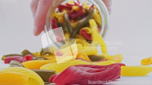 Image of Whole grain colorful pasta in camera motion