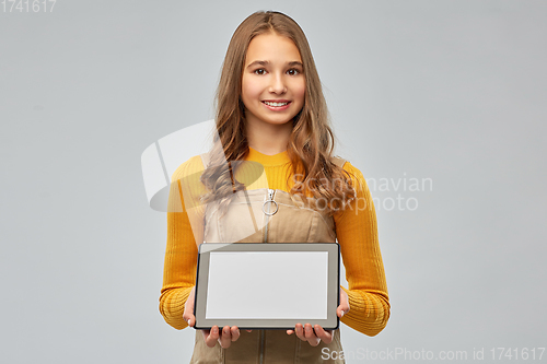 Image of teenage girl using tablet computer