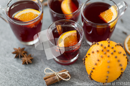 Image of glasses of mulled wine with orange and cinnamon