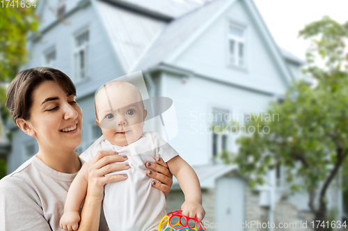 Image of happy young mother holding little baby daughter