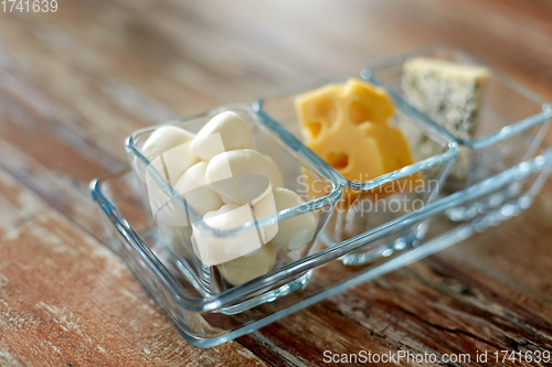 Image of different kinds of cheese in glass cups