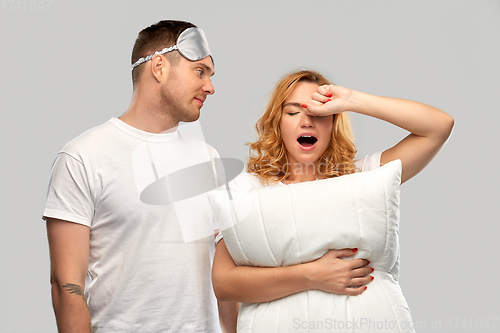 Image of couple with eye sleeping mask and pillow