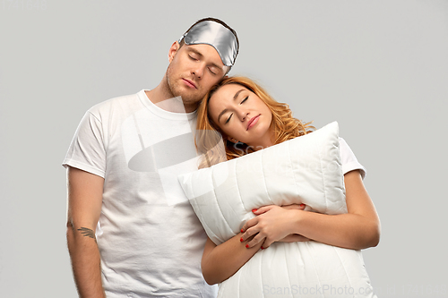 Image of couple with eye sleeping mask and pillow