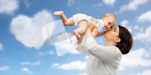 Image of happy mother kissing little baby daughter