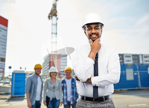 Image of indian architect in helmet over construction site