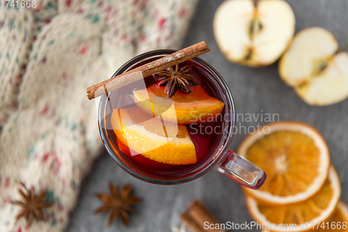 Image of glass of hot mulled wine with orange and cinnamon