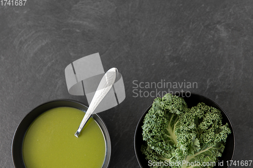 Image of kale cabbage cream soup in bowl with spoon