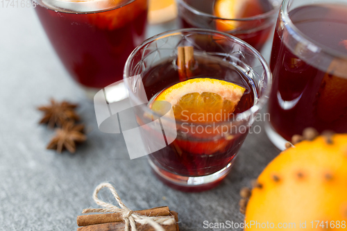 Image of glasses of mulled wine with orange and cinnamon