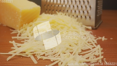 Image of Parmesan cheese on the table as ingridiend in camera motion