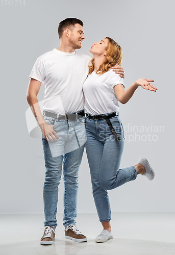 Image of couple in white t-shirts ready for kiss